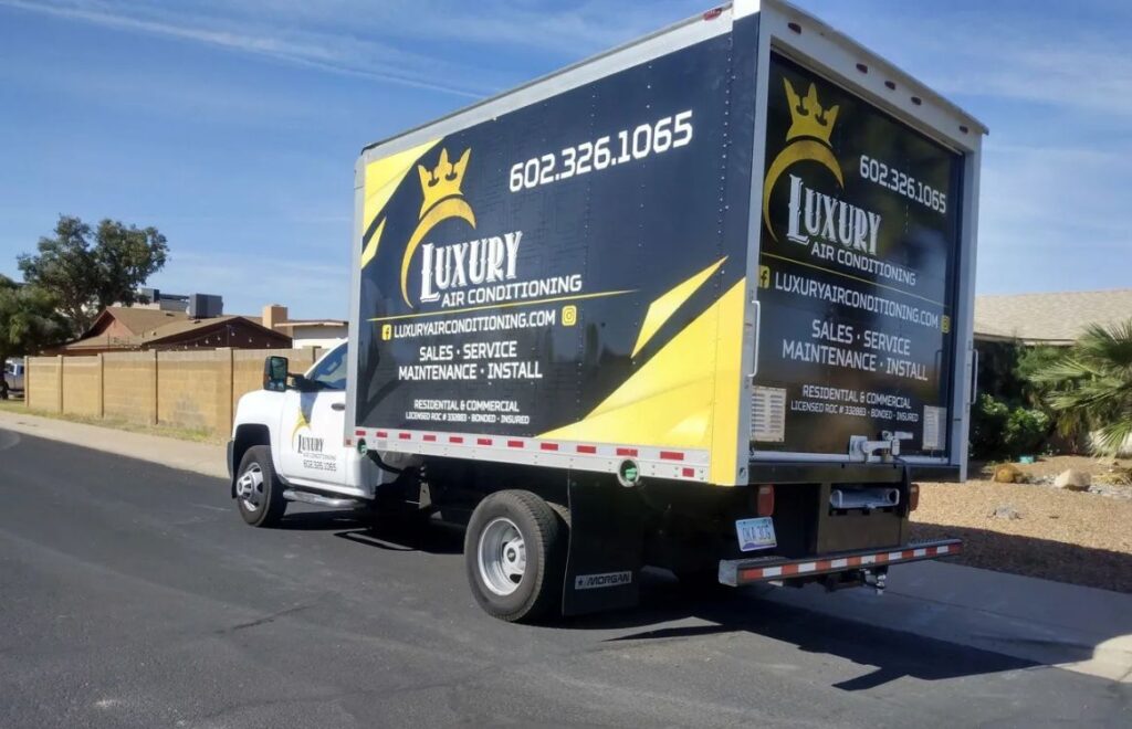 lacp-img-15 Logoed truck of Luxury Air Conditioning parked on a road, promoting HVAC services for residential and commercial clients.