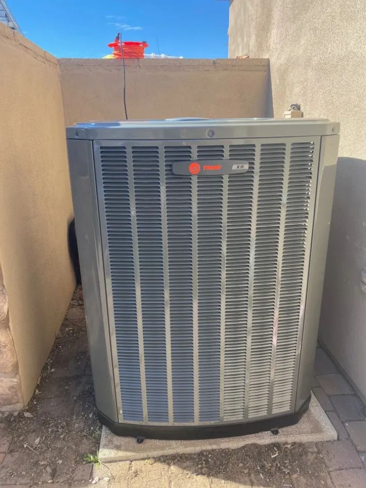 lacp-img-24 Outdoor air conditioning unit installed in a residential area, showcasing its efficient design and compact structure.